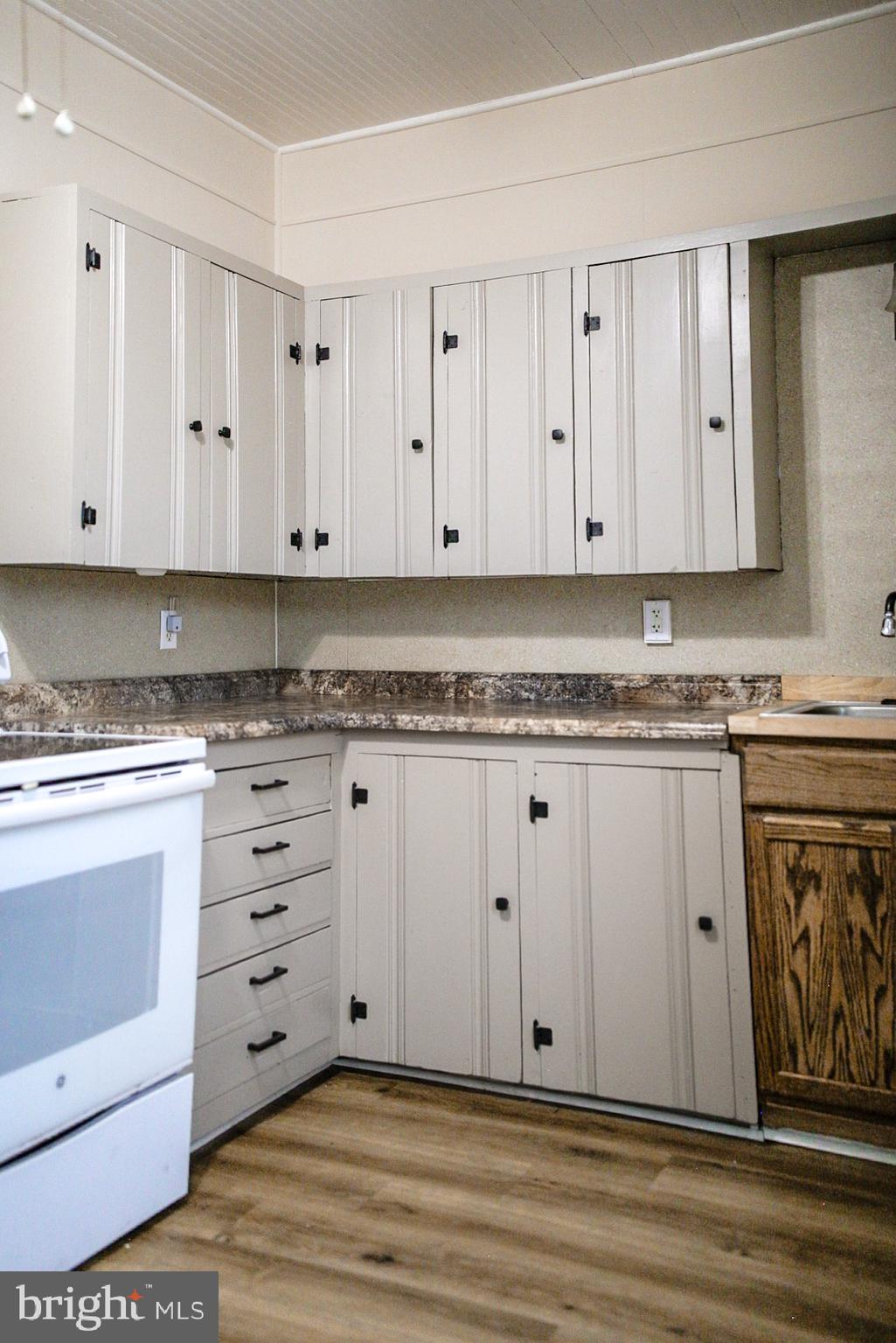 179 Main Street Hartly, DE 19953 - Photo 19 of 43 a view of cabinets with granite countertop