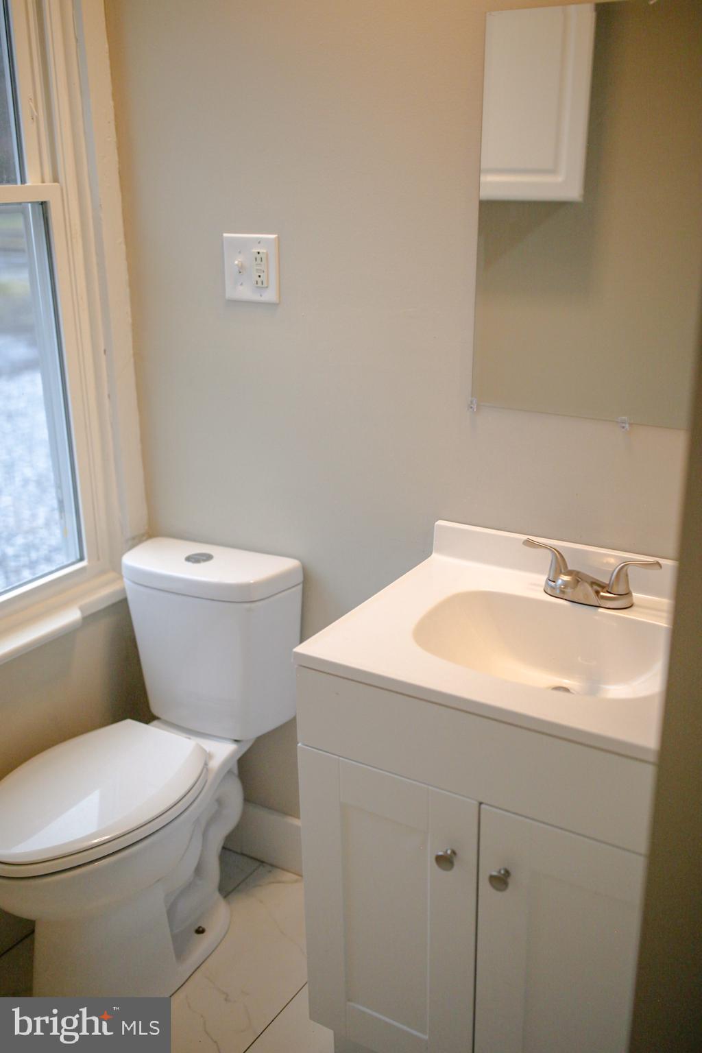 179 Main Street Hartly, DE 19953 - Photo 29 of 43 a white toilet sitting next to a bathroom sink