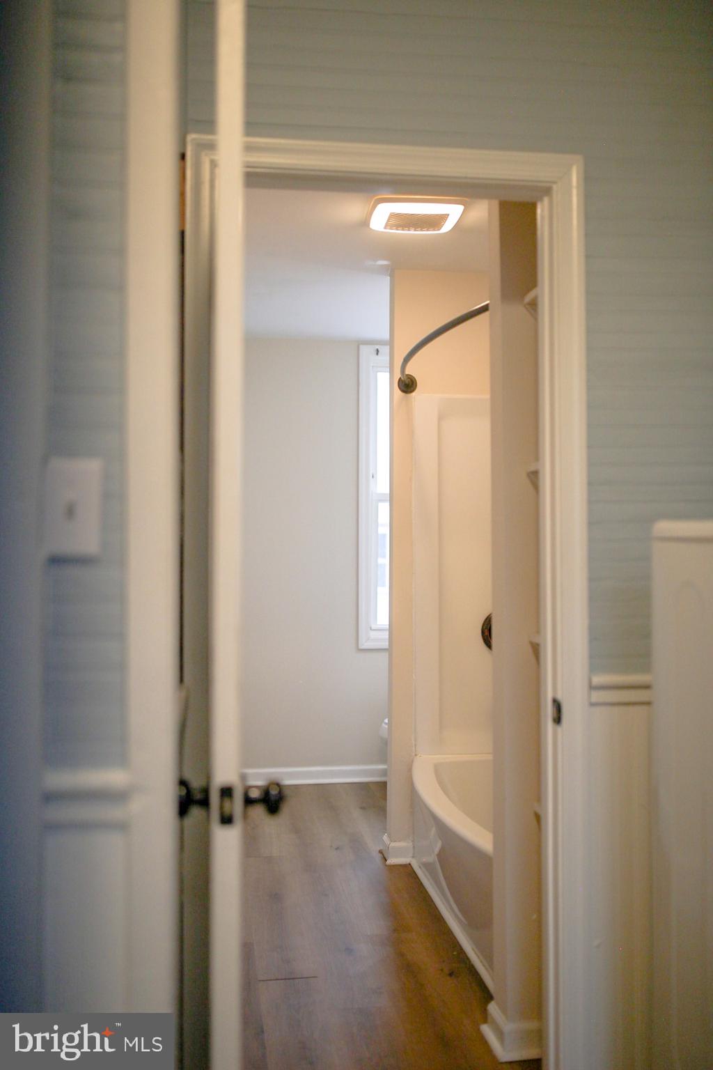 179 Main Street Hartly, DE 19953 - Photo 30 of 43 a bathroom with a glass shower door
