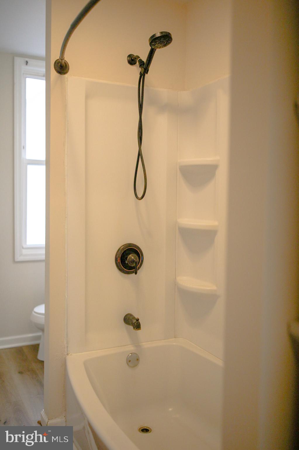 179 Main Street Hartly, DE 19953 - Photo 32 of 43 a bathroom with a bath tub with a shower
