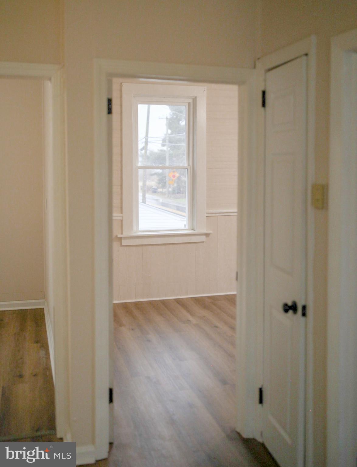 179 Main Street Hartly, DE 19953 - Photo 36 of 43 a view of an empty room with wooden floor and a window