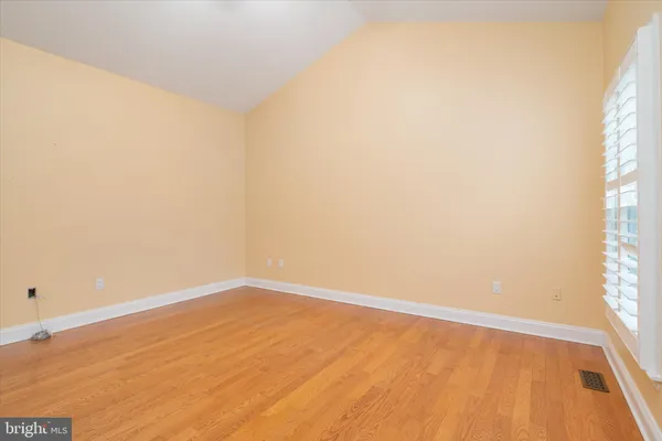 a kitchen with stainless steel appliances granite countertop a refrigerator a sink a stove a washer dryer and a cabinets