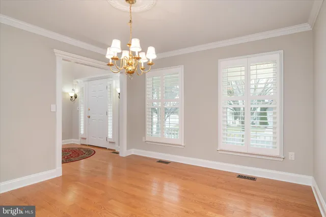a kitchen with a window and cabinets