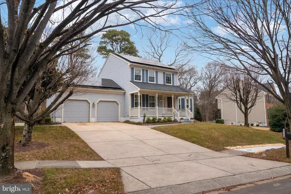 a front view of a house with yard