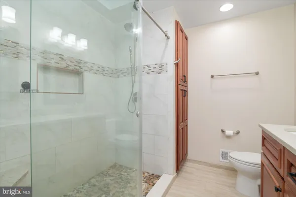 a kitchen with a refrigerator and a sink