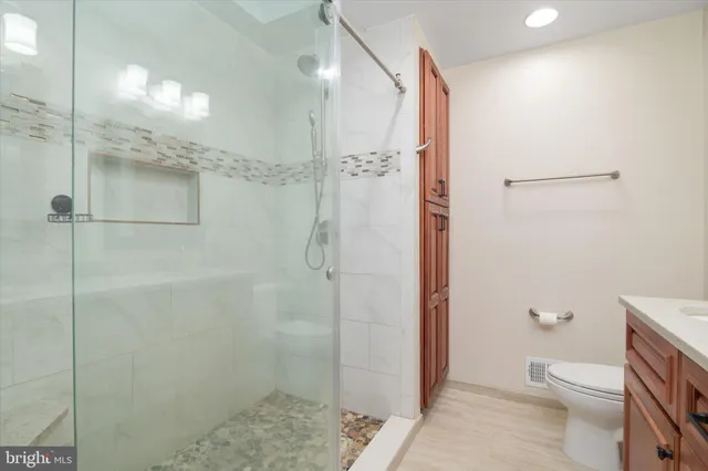 a kitchen with a refrigerator and a sink