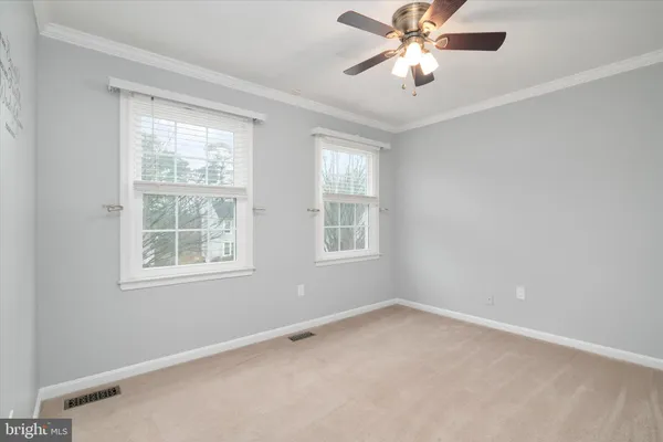 a kitchen with granite countertop a sink and a refrigerator