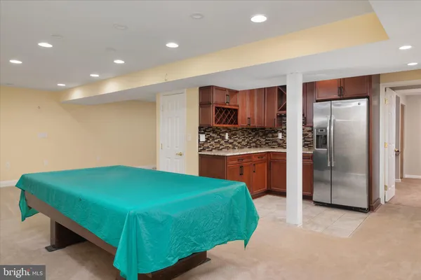 an aerial view of residential house with outdoor space and lake view