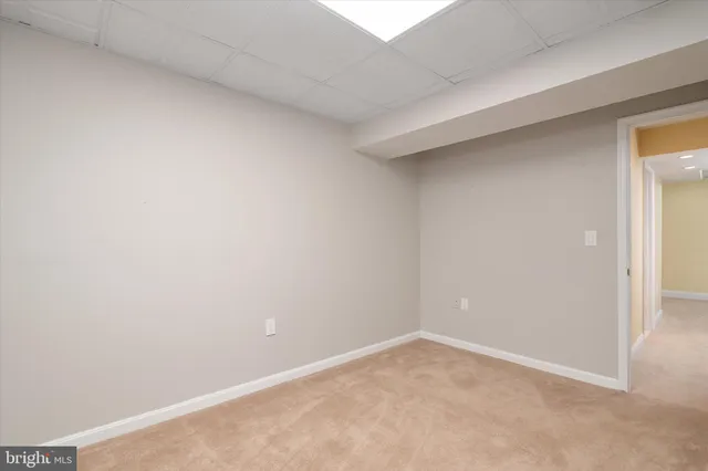a view of a house with a big yard and sitting area