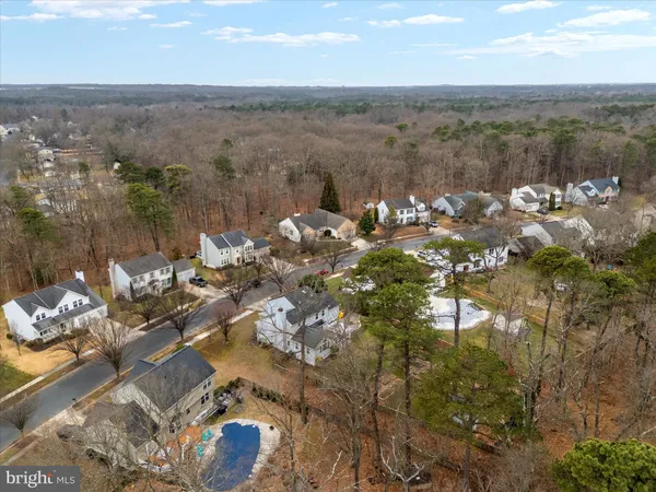 a view of a house with a wooden deck