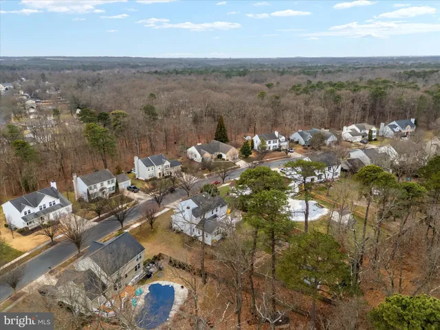 a view of a house with a wooden deck