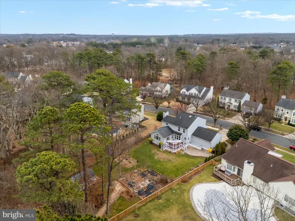 a view of a yard covered in snow