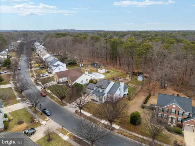 aerial view of a house with a yard