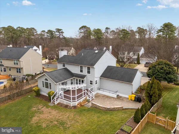 an aerial view of a house with a lake view