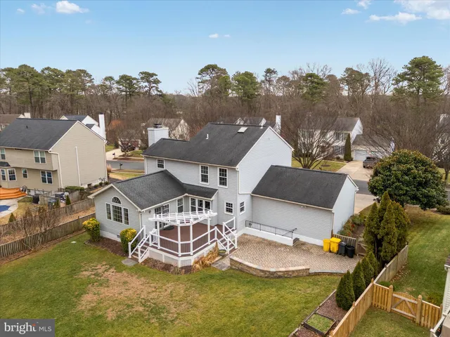 an aerial view of a house with a lake view