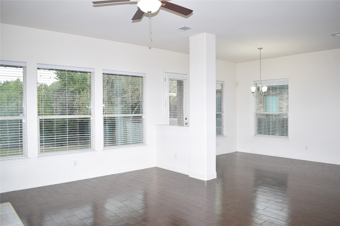 3001 Tempe Drive Cedar Park, TX 78641 - Photo 13 of 34 a view of an empty room with a window and wooden floor
