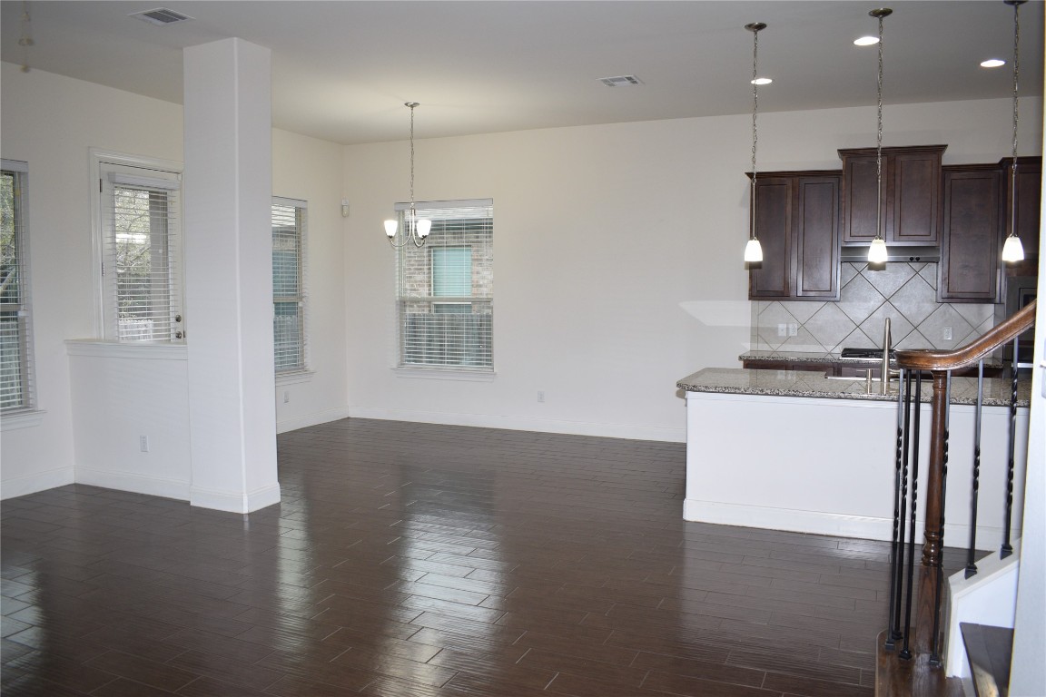 3001 Tempe Drive Cedar Park, TX 78641 - Photo 14 of 34 a view of a kitchen with a sink and a refrigerator