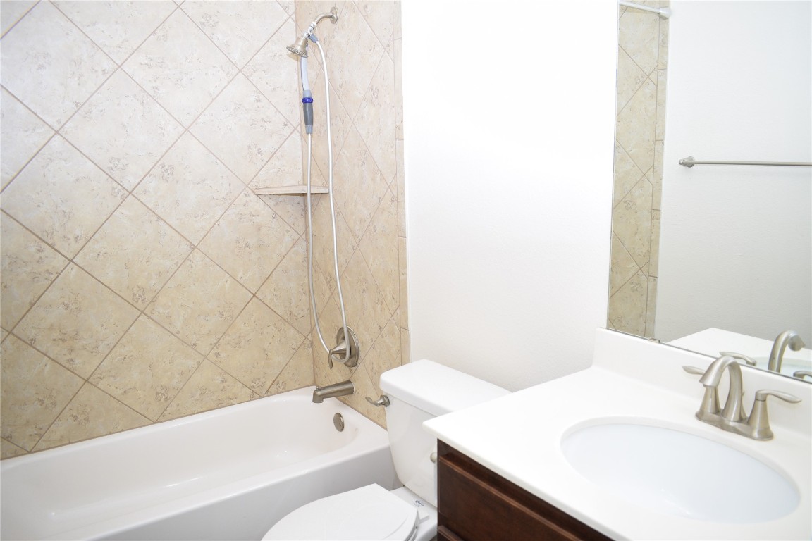 3001 Tempe Drive Cedar Park, TX 78641 - Photo 16 of 34 a bathroom with a sink and a mirror
