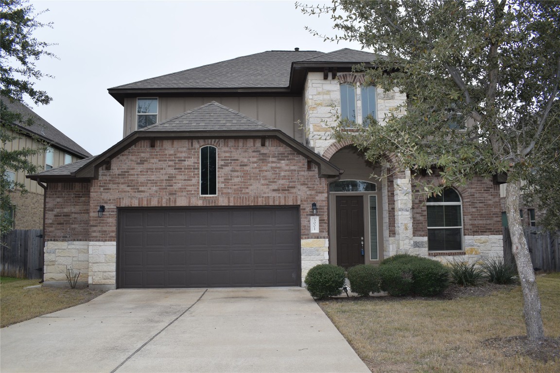 3001 Tempe Drive Cedar Park, TX 78641 - Photo 2 of 34 a front view of a house with garden