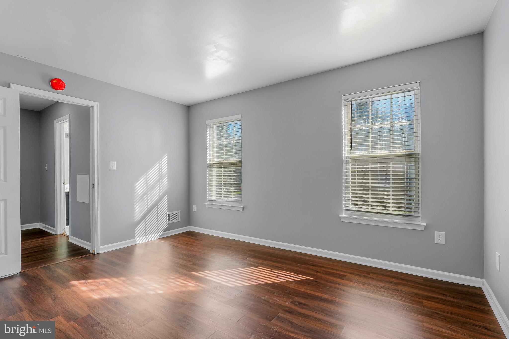 9503 Fletcher Avenue Clinton, MD 20735 - Photo 23 of 27 a living room with hardwood flooring and a window