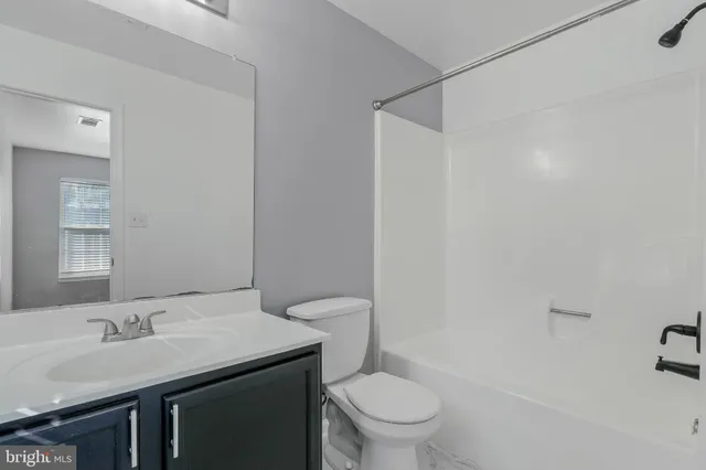 a bathroom with a sink toilet and vanity