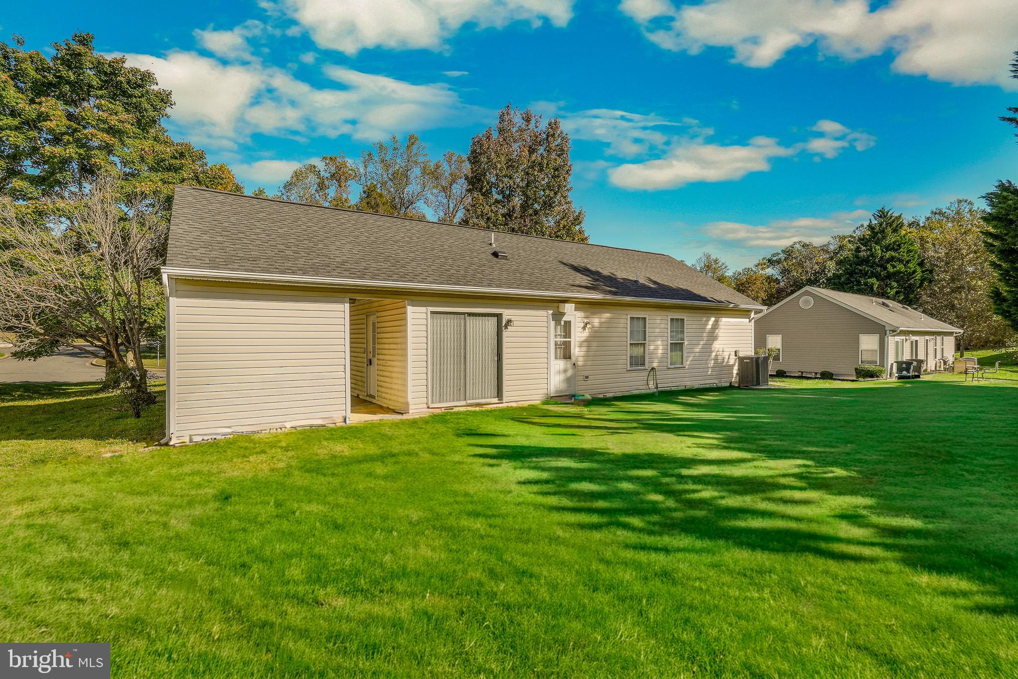 9503 Fletcher Avenue Clinton, MD 20735 - Photo 4 of 27 a front view of a house with a garden