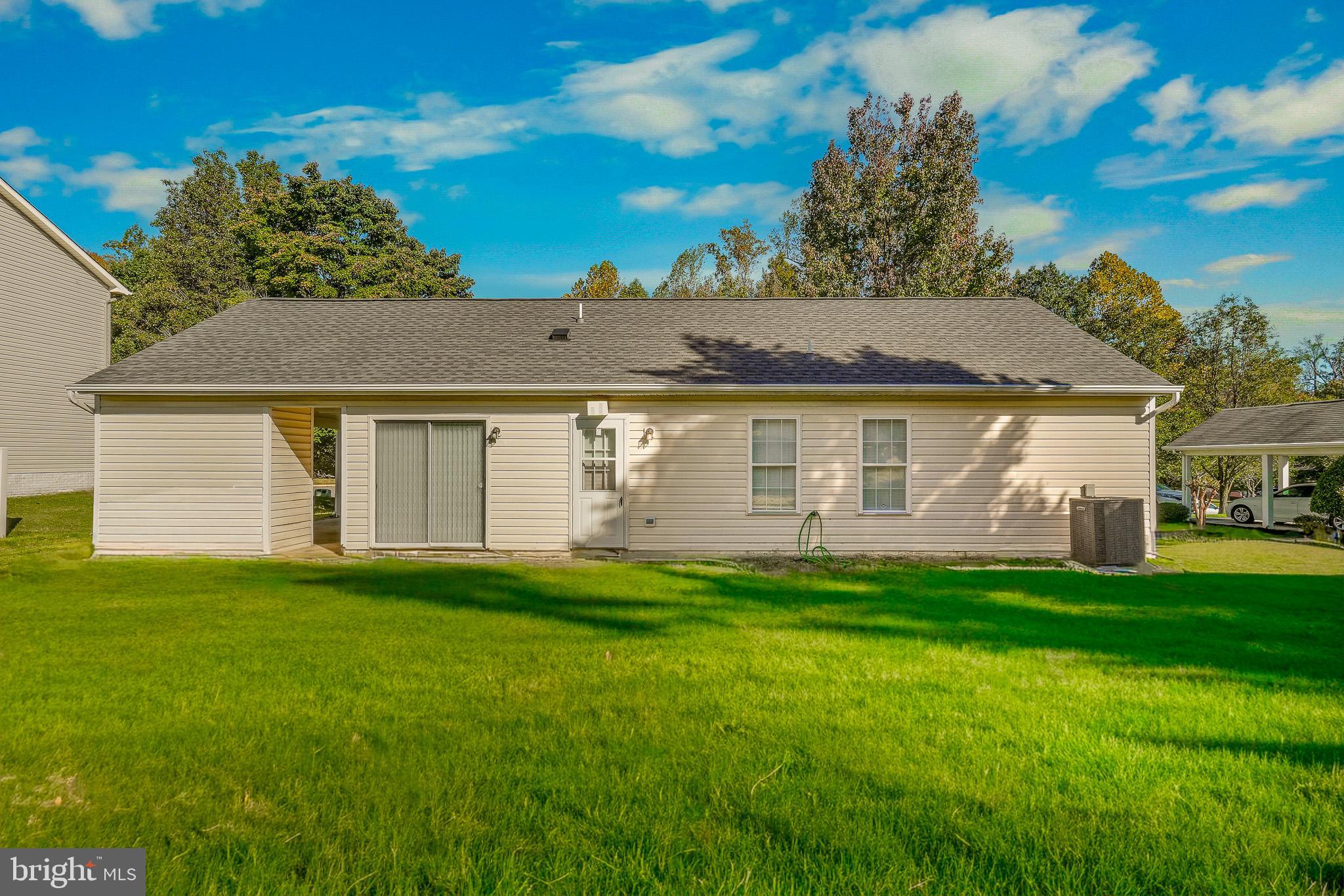 9503 Fletcher Avenue Clinton, MD 20735 - Photo 5 of 27 a front view of a house with a garden