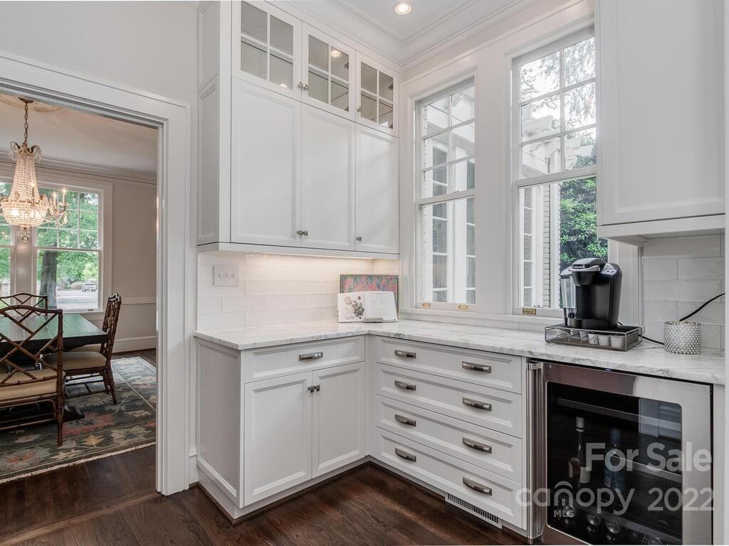 1210 Dilworth Road Charlotte, NC 28203 - Photo 13 of 39 a kitchen with stainless steel appliances granite countertop a stove and a sink