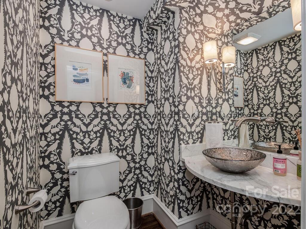 1210 Dilworth Road Charlotte, NC 28203 - Photo 14 of 39 a bathroom with a toilet and a shower curtain