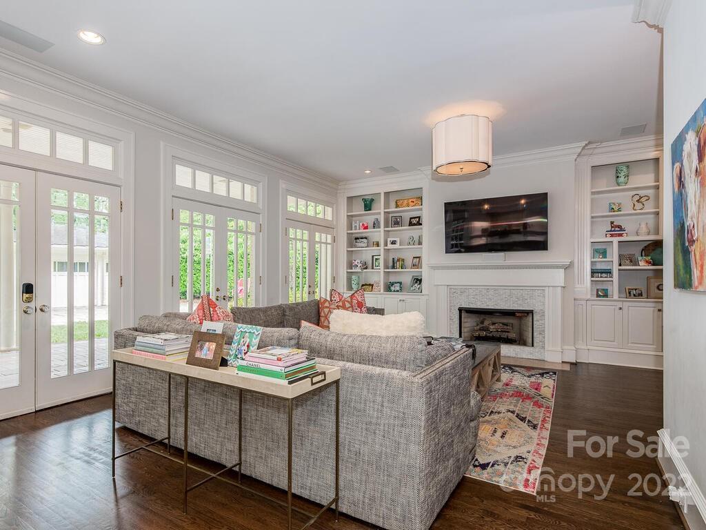 1210 Dilworth Road Charlotte, NC 28203 - Photo 15 of 39 a living room with furniture fireplace and flat screen tv