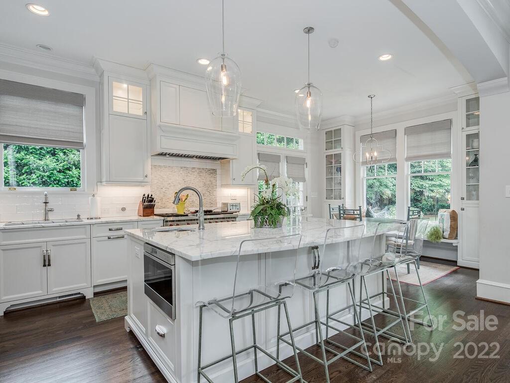 1210 Dilworth Road Charlotte, NC 28203 - Photo 16 of 39 a kitchen with a sink stove and cabinets