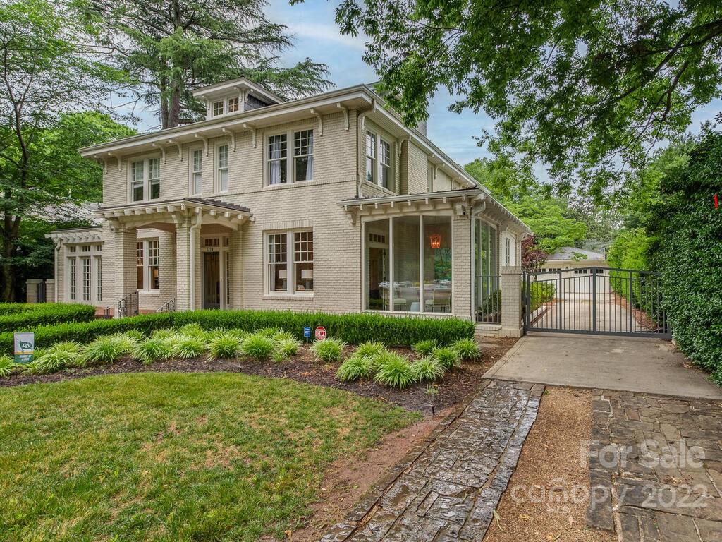 1210 Dilworth Road Charlotte, NC 28203 - Photo 2 of 39 a front view of a house with a yard and potted plants