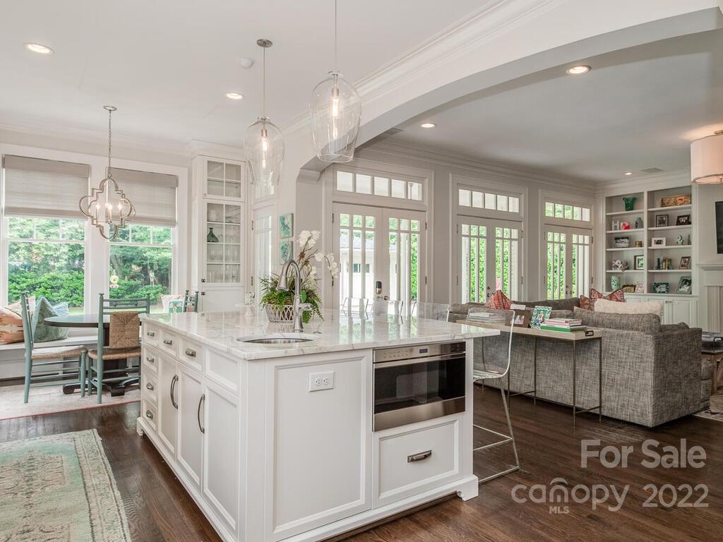 1210 Dilworth Road Charlotte, NC 28203 - Photo 21 of 39 a kitchen with center island and windows