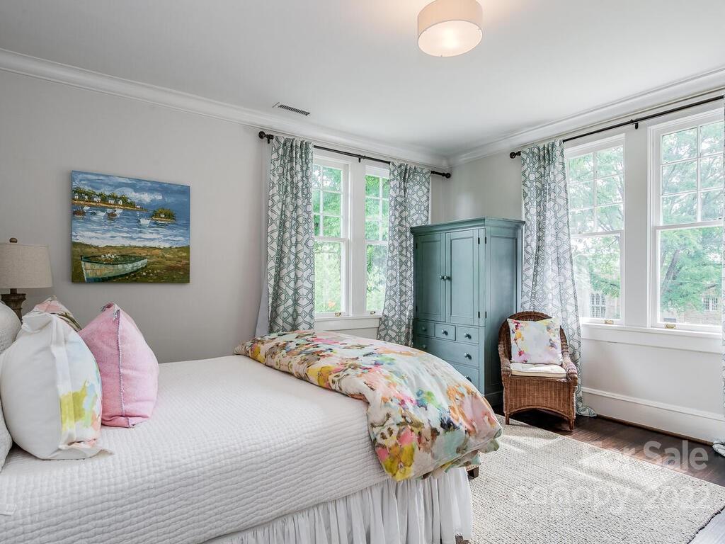1210 Dilworth Road Charlotte, NC 28203 - Photo 22 of 39 a bedroom with a bed and a window