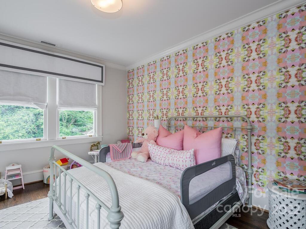 1210 Dilworth Road Charlotte, NC 28203 - Photo 26 of 39 a bedroom with a bed and a window