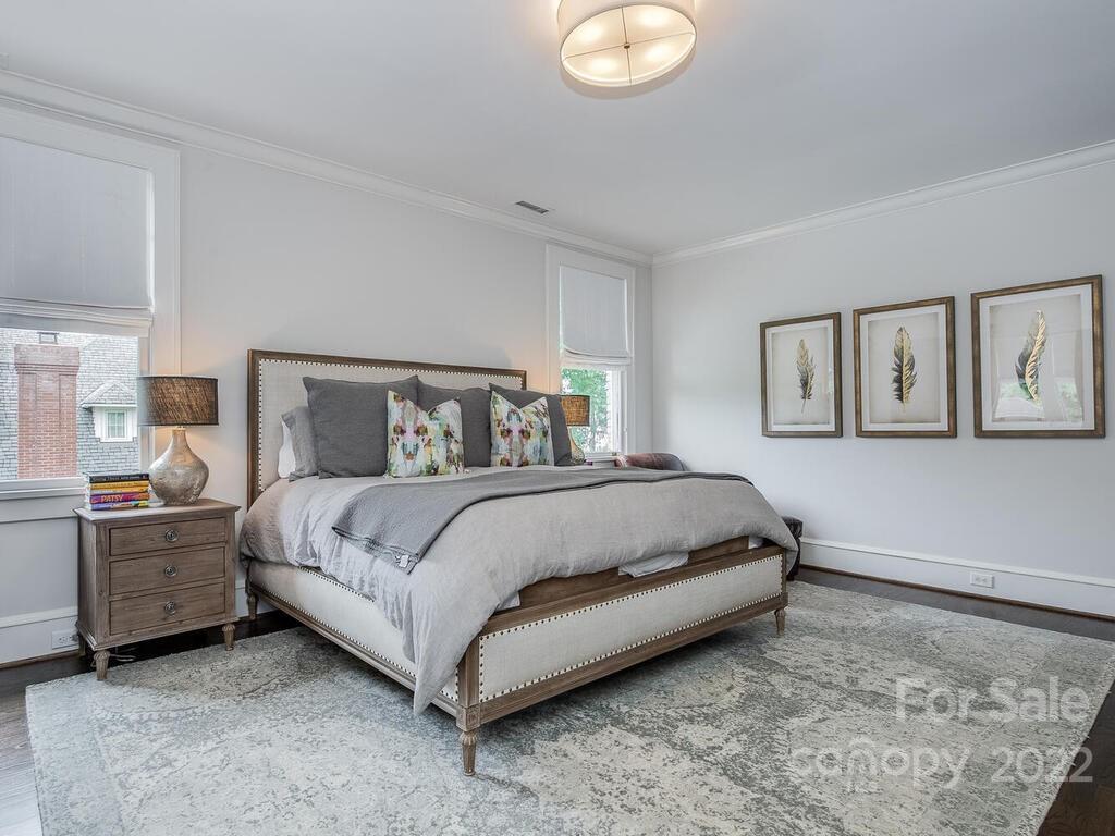 1210 Dilworth Road Charlotte, NC 28203 - Photo 30 of 39 a bedroom with a bed and painting on the wall