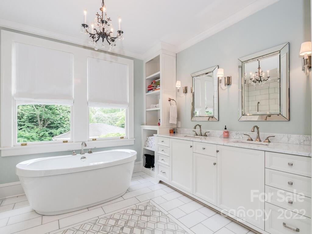 1210 Dilworth Road Charlotte, NC 28203 - Photo 31 of 39 a bathroom with a large tub sink and window