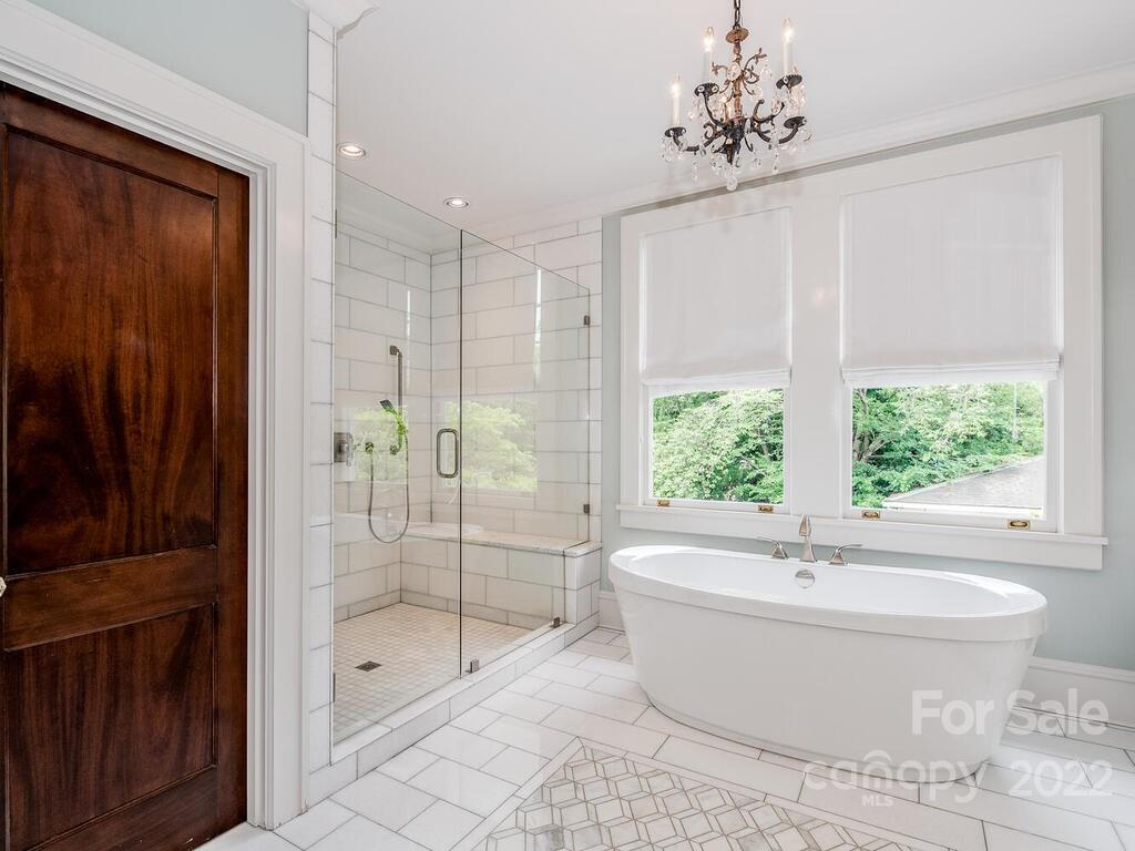 1210 Dilworth Road Charlotte, NC 28203 - Photo 32 of 39 a bathroom with a bathtub and shower