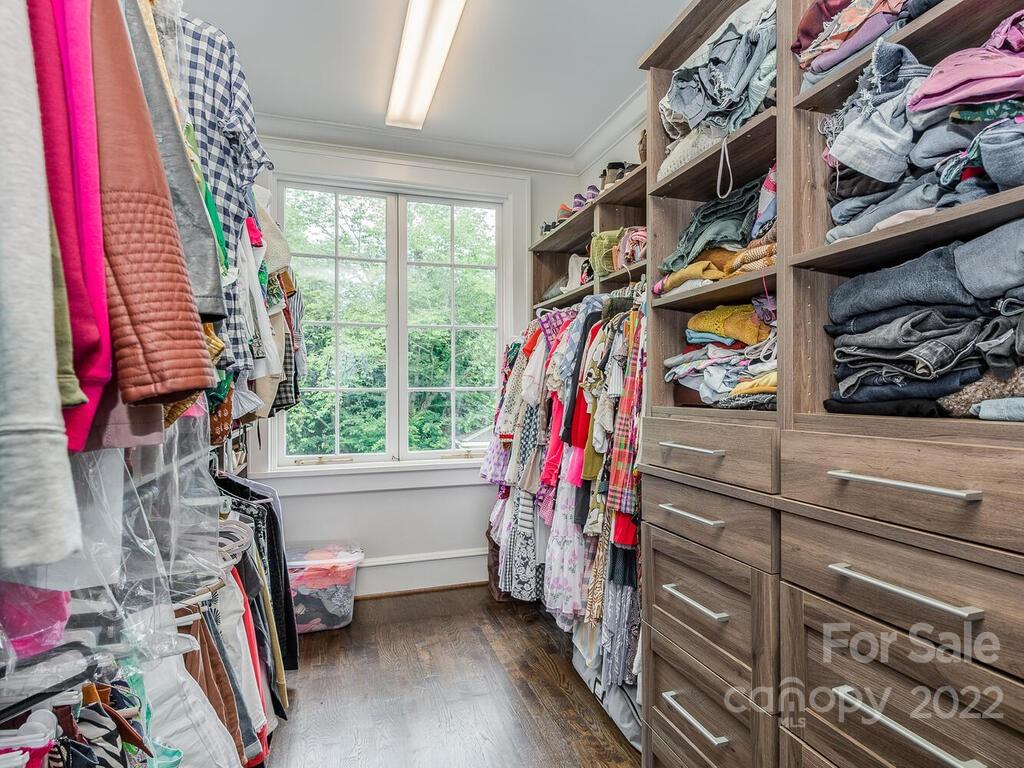 1210 Dilworth Road Charlotte, NC 28203 - Photo 33 of 39 a view of walk in closet with clothes and shoes