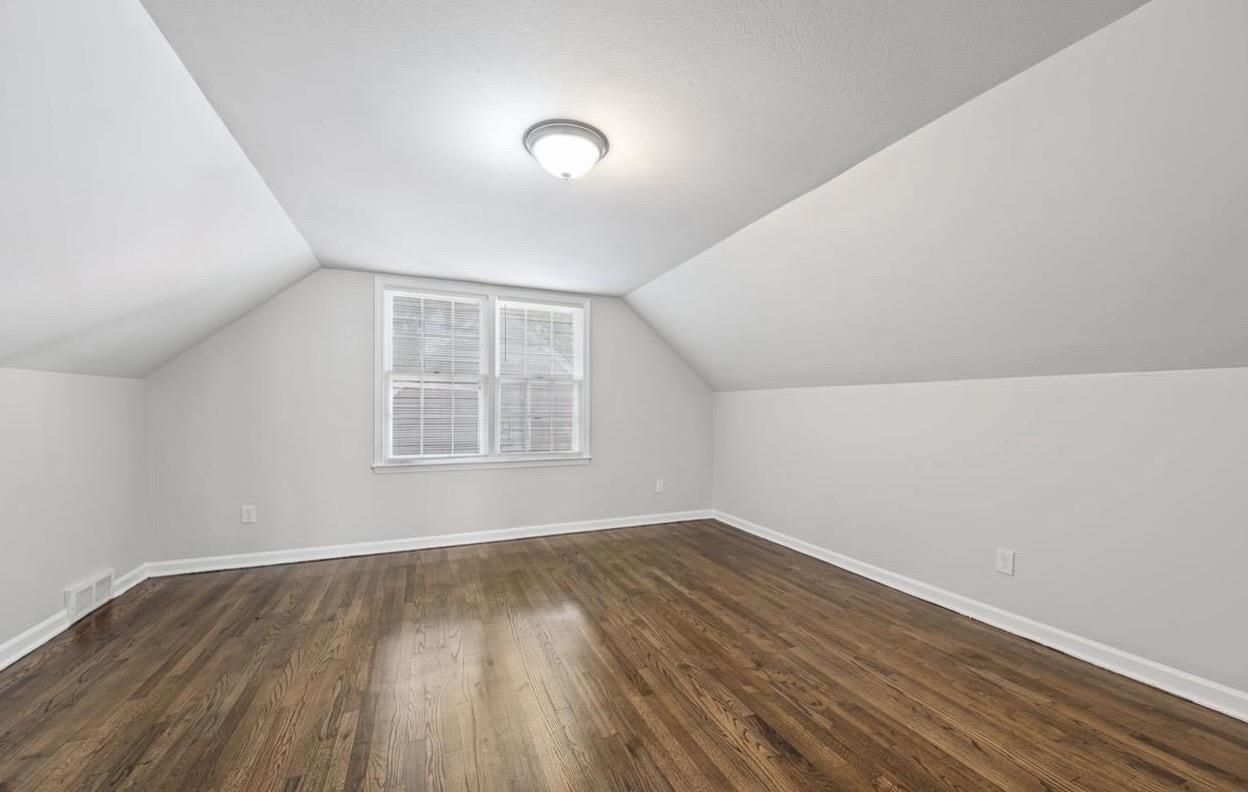 3843 Blue Jay Road Memphis, TN 38116 - Photo 20 of 23 an empty room with wooden floor and windows