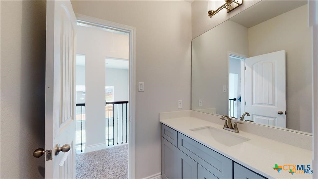 8601 Ridge Crest Drive Killeen, TX 76542 - Photo 20 of 30 a bathroom with a sink and a mirror