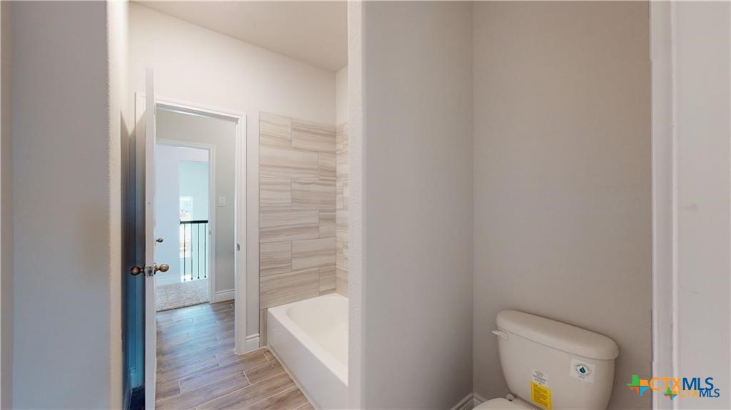 8601 Ridge Crest Drive Killeen, TX 76542 - Photo 21 of 30 a bathroom with a toilet and a shower