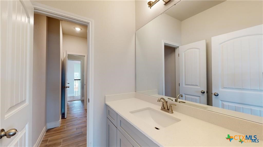 8601 Ridge Crest Drive Killeen, TX 76542 - Photo 22 of 30 a bathroom with a sink and a mirror