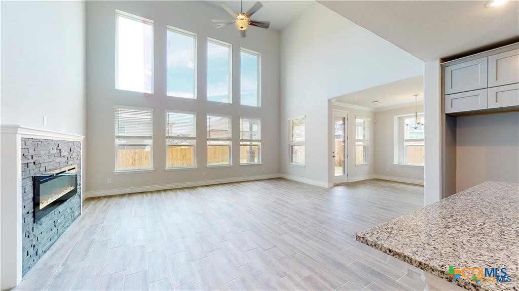 8601 Ridge Crest Drive Killeen, TX 76542 - Photo 3 of 30 a view of an empty room with a window and wooden floor