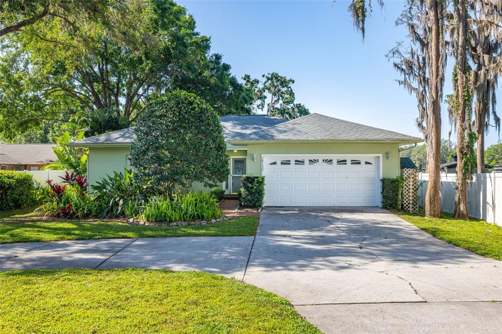 18132 Oakdale Road Odessa, FL 33556 - Photo 1 of 40 a front view of a house with a yard and garage