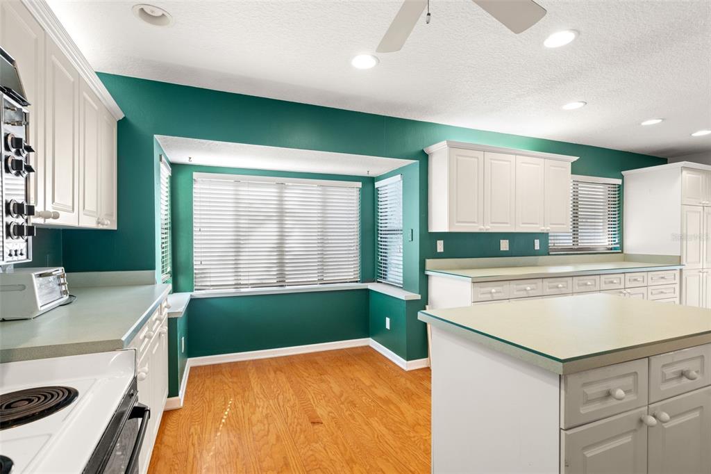 18132 Oakdale Road Odessa, FL 33556 - Photo 16 of 40 a kitchen with a sink and a stove top oven