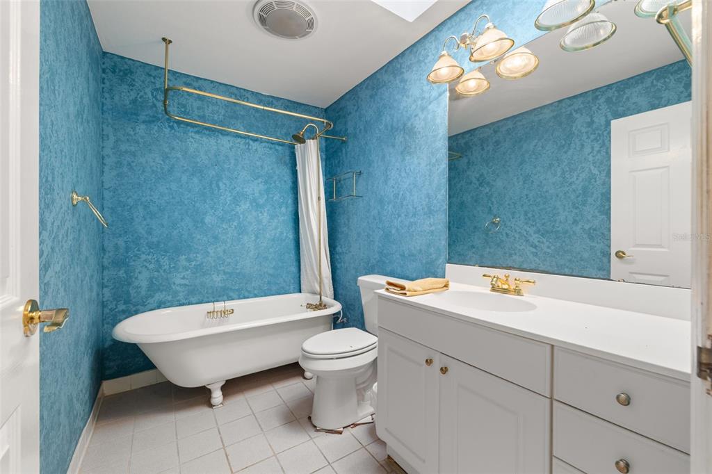 18132 Oakdale Road Odessa, FL 33556 - Photo 22 of 40 a bathroom with a toilet sink and mirror