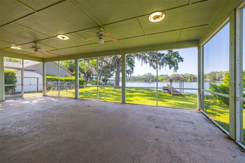 18132 Oakdale Road Odessa, FL 33556 - Photo 27 of 40 a view of an empty room with a swimming pool