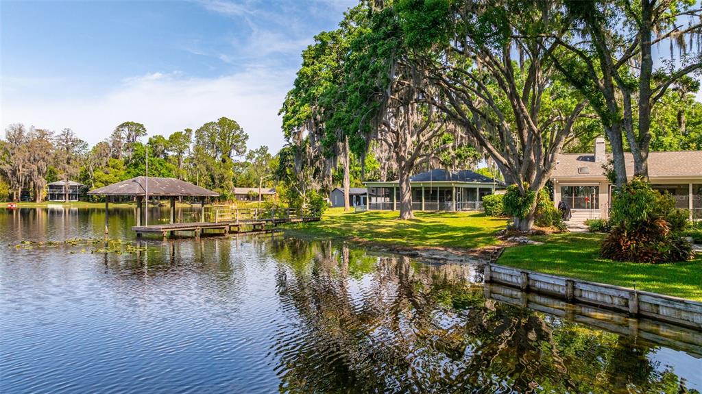 18132 Oakdale Road Odessa, FL 33556 - Photo 33 of 40 a view of a lake with a house in the background