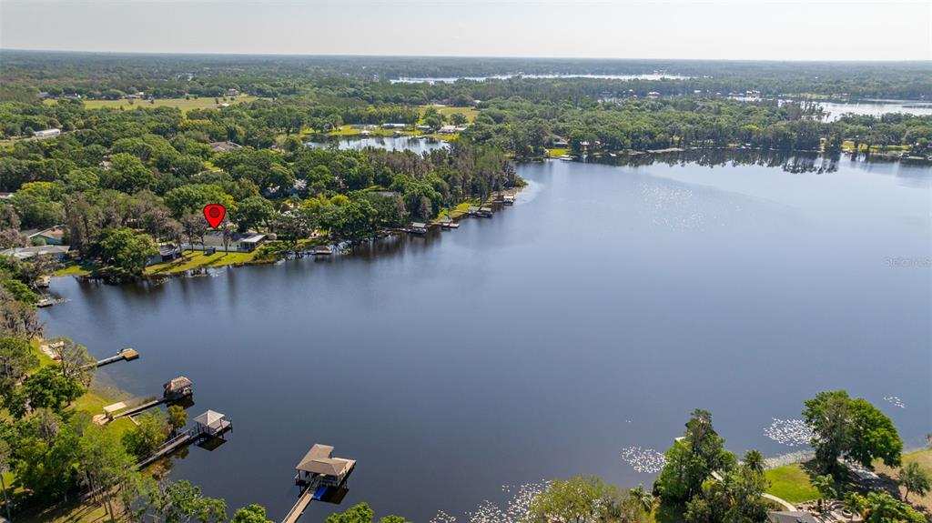 18132 Oakdale Road Odessa, FL 33556 - Photo 37 of 40 an aerial view of a houses with a lake view